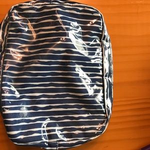 Estée Lauder makeup bag, very shiny.